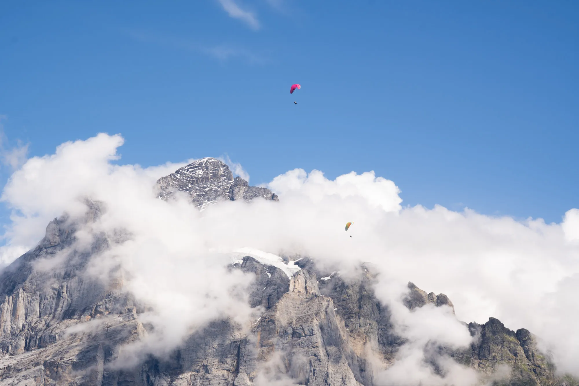 grindelwald paragliding over cloudy eiger