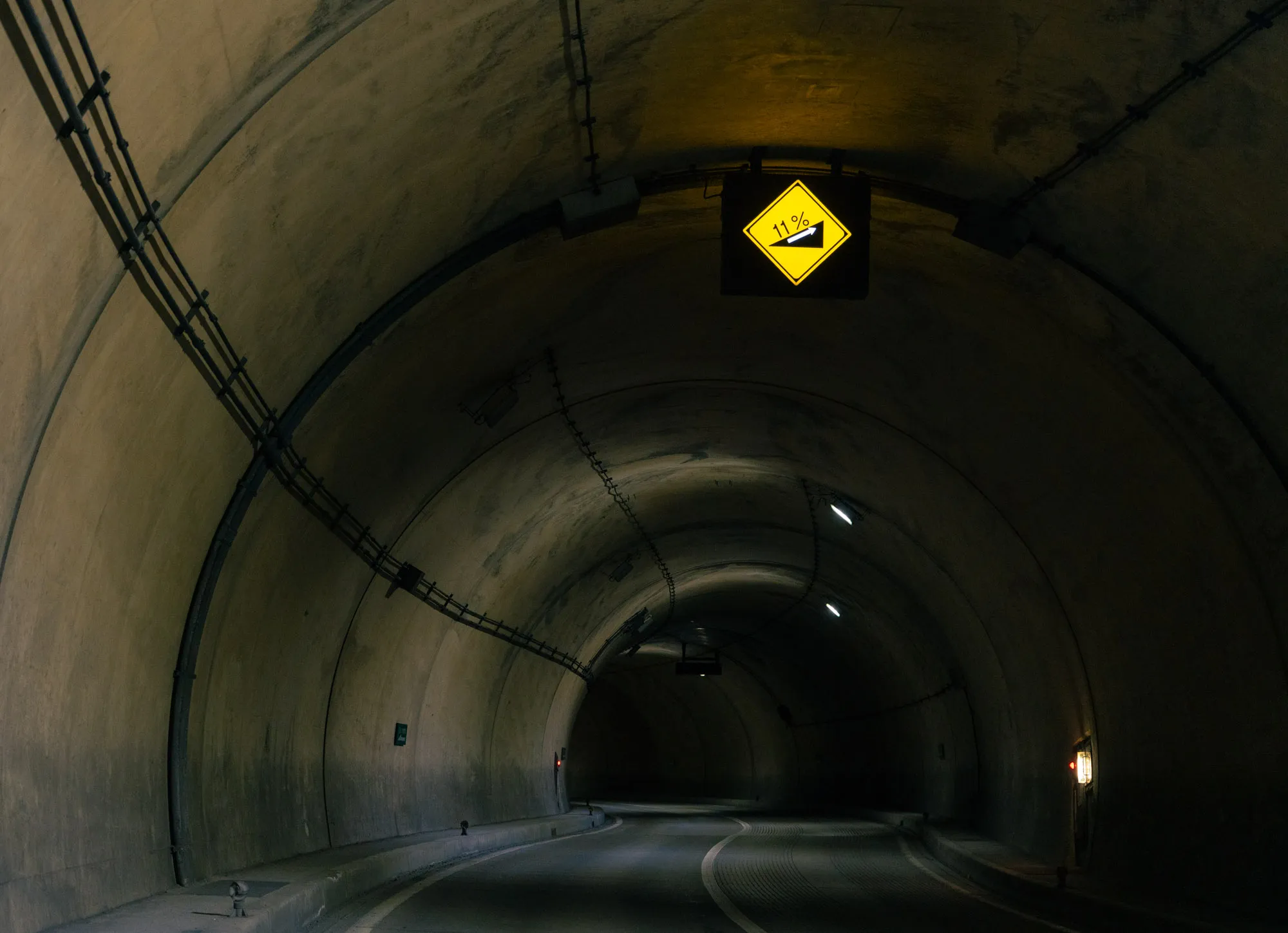 kamikochi tunnel with slope sign